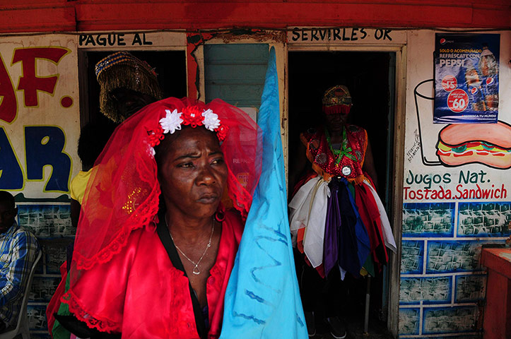 Haiti - A longer view: People dressed for a Gaga ceremony near Santo Domingo