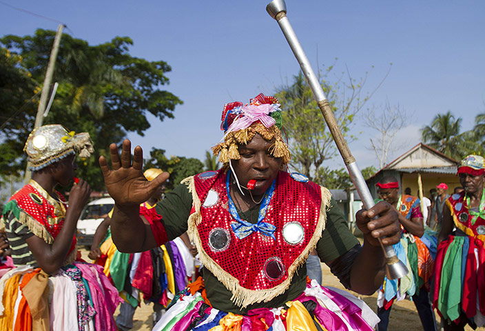 Haiti - A longer view: A woman participates in the ritual in the Dominican Republic
