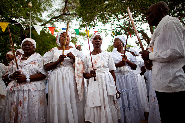 Haiti - A longer view: Haitians participate in a ritual during a Voodoo Festival