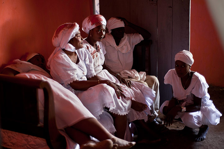 Haiti - A longer view: Voodoo believers gather after the ceremony in Haiti