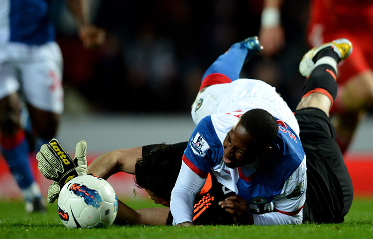 Blackburn v Liverpool: Alexander Doni of Liverpool brings down Junior Hoilett of Blackburn Rovers