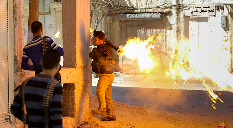 Aleppo, Syria: A rebel of the Free Syrian Army fires a rocket propelled-grenade