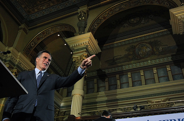 Pointing Mitt: Mitt Romney speaks to supporters at The Grain Exchange in Milwaukee