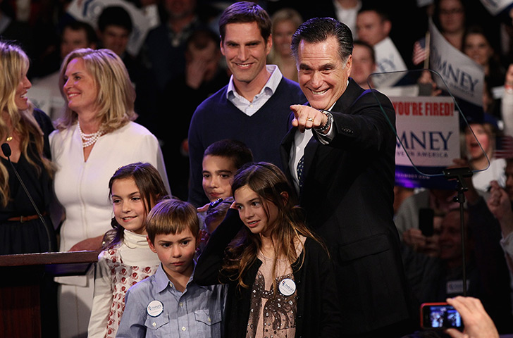 Pointing Mitt: Mitt Romney points to supporters during his primary night rally