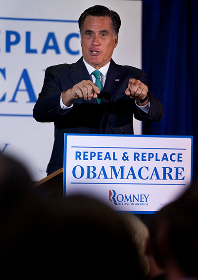 Pointing Mitt: Mitt Romney speaks at a medical device company in San Diego, California