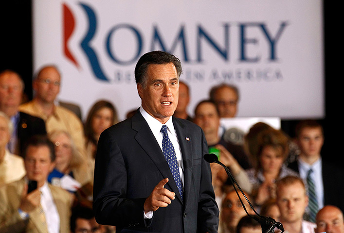 Pointing Mitt: Mitt Romney speaks at his Illinois primary night rally in Schaumburg