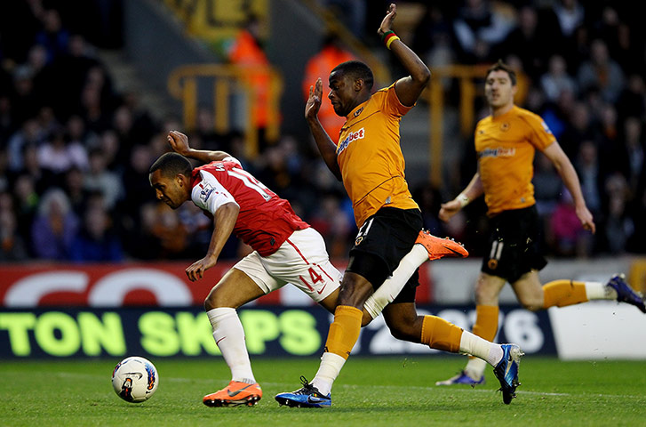 Wednesday footie: Sébastien Bassong fouls Theo Walcott