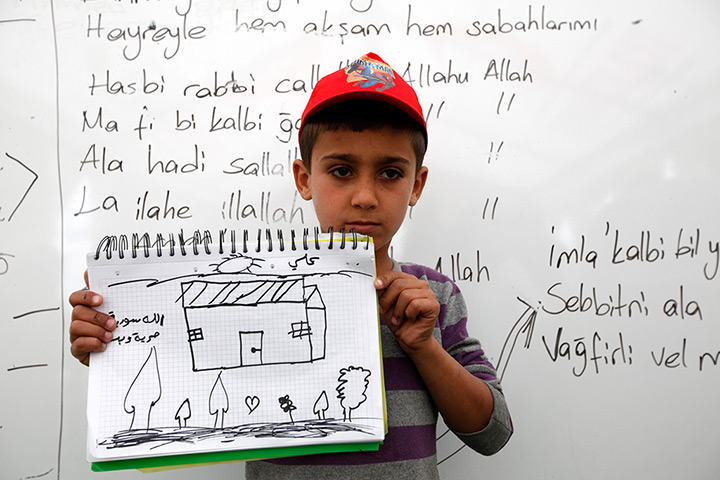 Boynuyogun refugee camp: Children show drawings of their dream home at Boynuyogun refugee camp