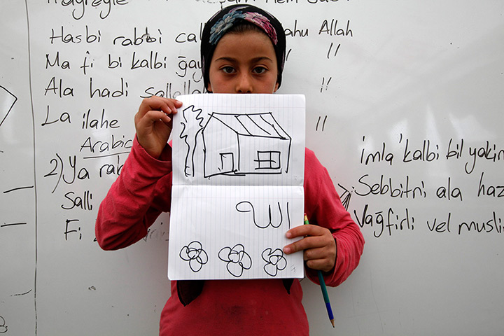 Boynuyogun refugee camp: Children show drawings of their dream home at Boynuyogun refugee camp