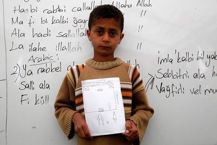 Boynuyogun refugee camp: Children show drawings of their dream home at Boynuyogun refugee camp