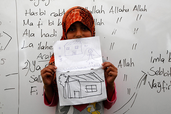 Boynuyogun refugee camp: Children show drawings of their dream home at Boynuyogun refugee camp