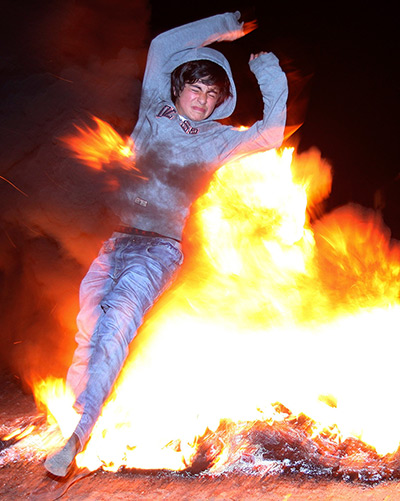Tbilisi Georgia A boy jumps through a fire during the Chiakokonoba folk 