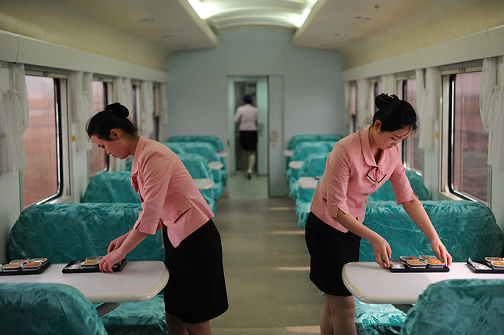 From the agencies: Two members of train crew serve food
