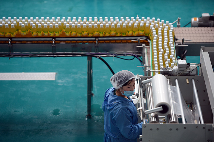 From the agencies: Worker operate a fruit juice factory on the outskirts of Pyongyang
