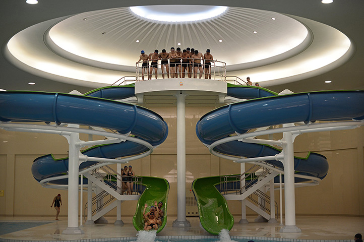 From the agencies: North Korean students ride down a water slide