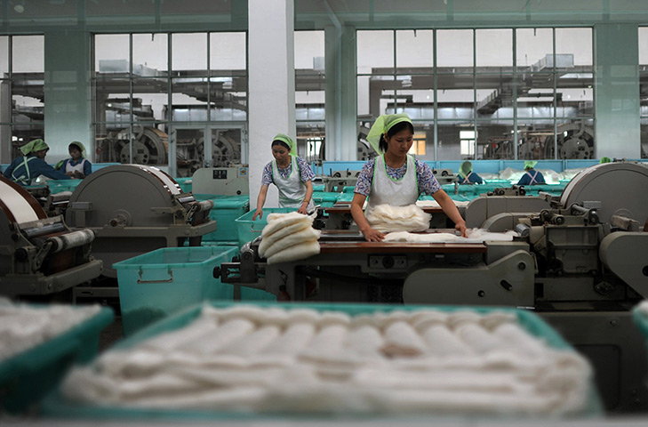 From the agencies: North Korean women work in a textile factory in Pyongyang