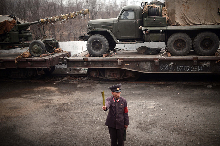 From the agencies: A North Korean controller along a railway line
