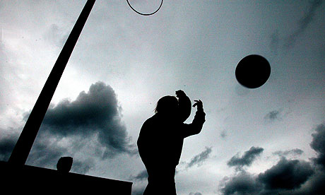 Silhouette of someone playing with a ball