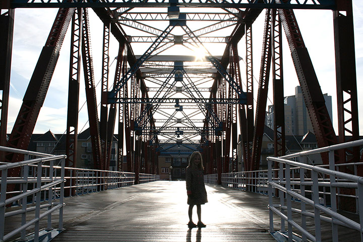 Your Pictures: Your Pictures: girl under electricity pylons forming a geometric pattern