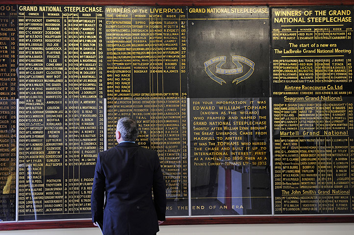 National: Punter checks out the winners' board at Aintree
