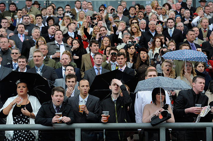 National: Punters watch the first race