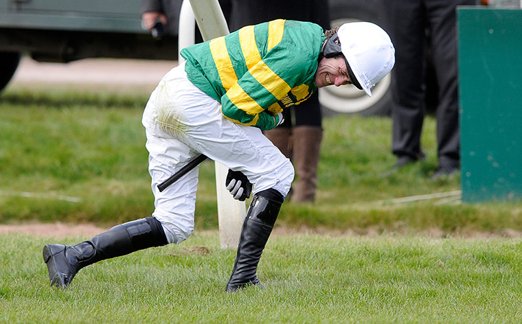 National: McCoy winces as he holds his arm