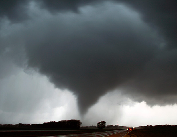 Tornados: A tornado makes its way over the 135 freeway near Moundridge, Kansas
