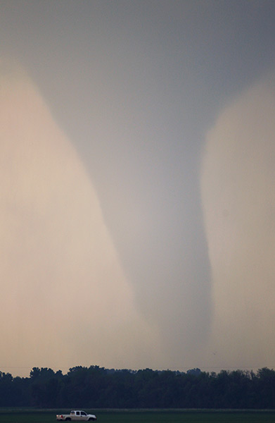 Tornados: A truck drives along I-70 as a tornado moves north of Soloman, Kansas