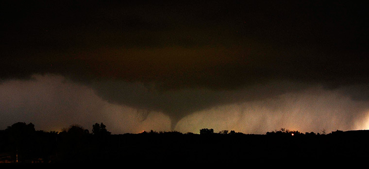 Tornados: A tornado on the ground makes it way through the night near Salin, Kansas