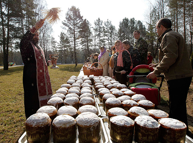 Orthodox Easter: An Orthodox priest blesses Easter cakes during an Easter service in Belarus