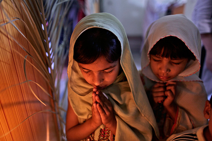 Orthodox Easter: Pakistani Christian Orthodox girls pray in Islamabad, Pakistan