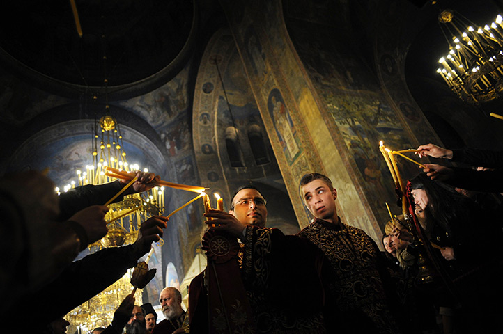 Orthodox Easter: Bulgarian Orthodox priests share the holy light in Sofia