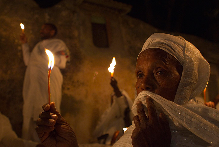 Orthodox Easter: Ethiopian Orthodox worshippers hold candles in Jerusalem's Old City