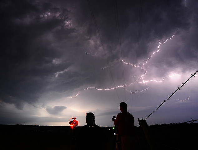 24 hours: Apache City, Oklahoma, US: Storm chaser photographers take photos