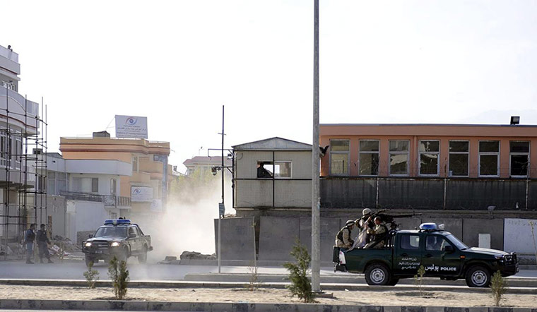 Afghanistan attacks: Afghan security officials secure site during a shooting incident