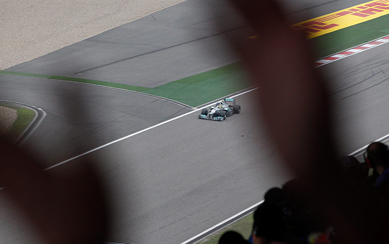 Chinese Grand Prix: Spectators cheer as Nico Rosberg crosses the finish line