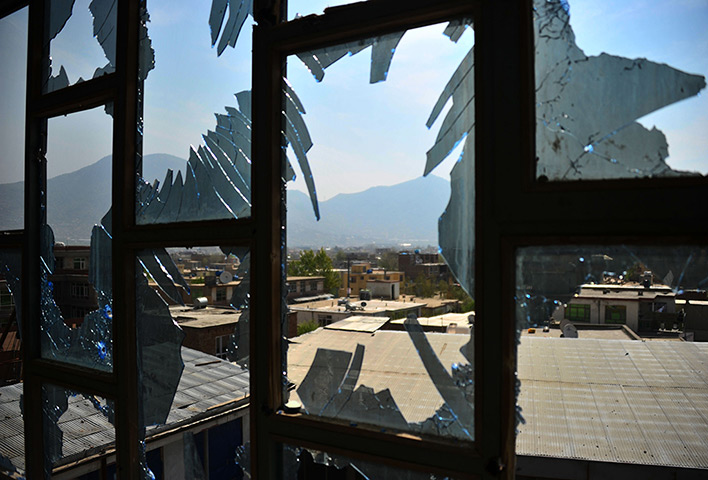 Afghanistan violence: The city of Kabul is seen through broken windows, a day after attacks