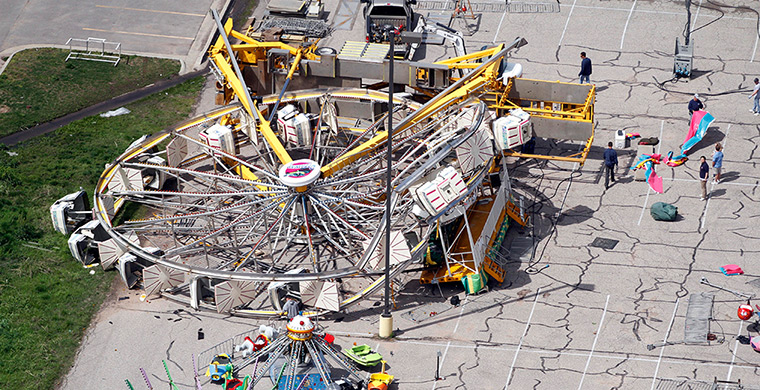 Tornado damage: Workers check out a ferris wheel that was damaged in Wichita, Kansas
