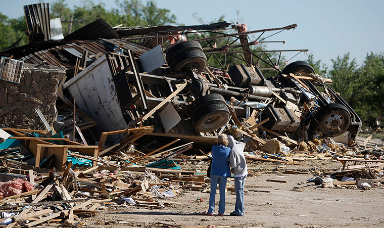 Tornado damage: People stand by the remains of a business in Woodward, Oklahoma