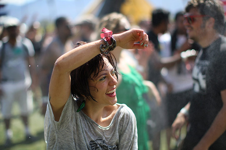 Coachella days 2 and 3: People dance under water sprayed from hoses at the Do Lab