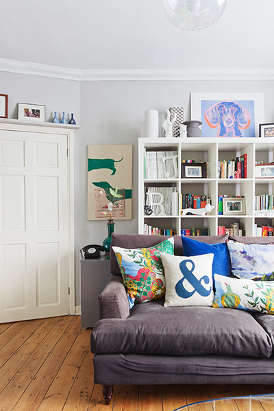 Homes Feature: Homes feature, living room with square bookshelves and a grey sofa