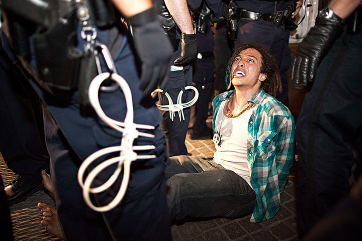 24 hours in pictures:  An Occupy Wall Street protester is arrested in front of Federal Hall