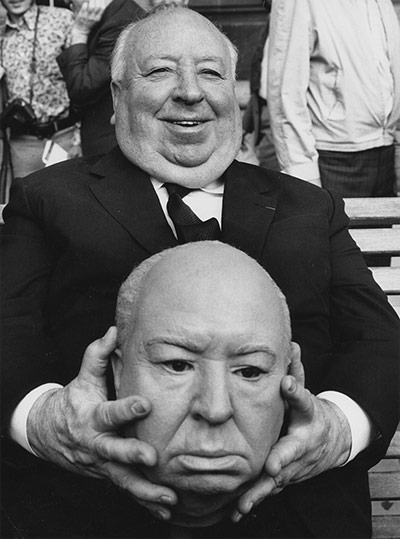 Genius of Hitchcock: Hitchcock holding a waxwork of his face on the set of Frenzy, 1972