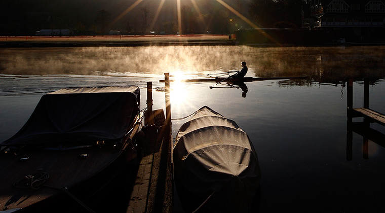 24 hours: Henley-on-Thames, England: A rower early in the morning on the River Thames