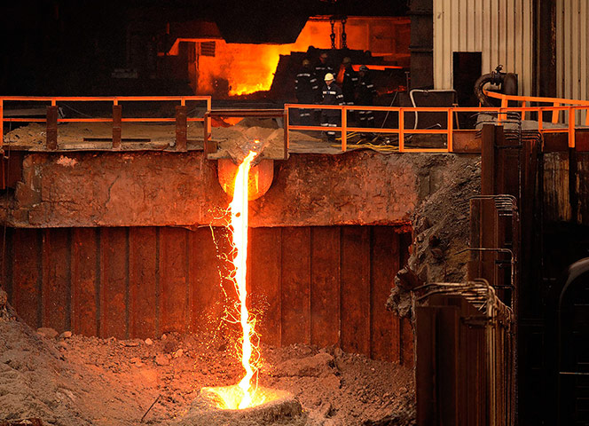 News pictures of the day: The blast furnace is seen in operation at the steel plant in Redcar