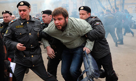 A Pussy Riot supporter is arrested by Russian police outside a court in