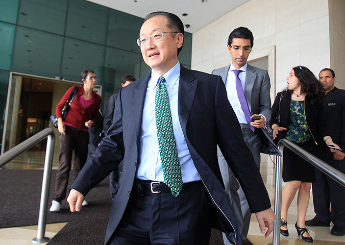 Week in Business: New World Bank President Jim Yong Kim leaves a hotel in Lima