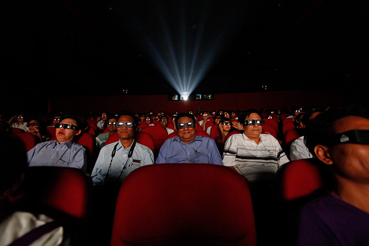 Picture Desk Live: People watch a 3D movie at the Minglar cinema in Rangoon