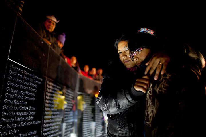 24 hours: Ushuaia, Argentina: People look at the names of Argentinian soldiers killed