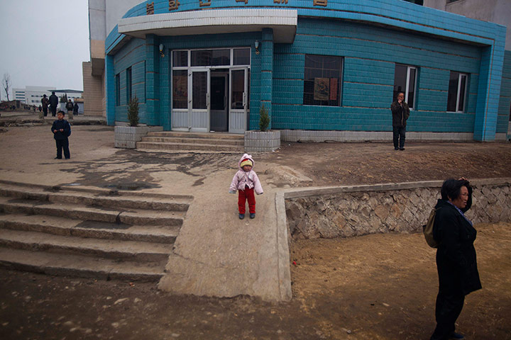 Longer view: North Korean residents of the capital city mingle